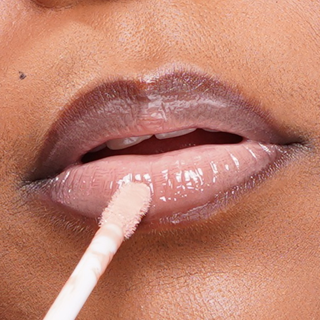 Bombshell- light nude tinted cream gloss.